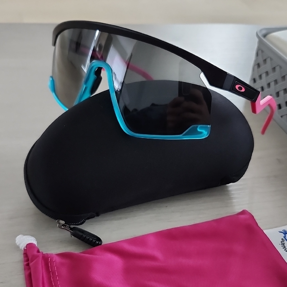 Oakley Black Frame Sunglasses with Blue and Pink Accents